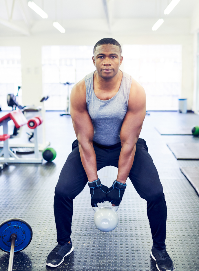Man doing Kettlebell squats